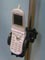legacy flip phone pictured with mobile device holder